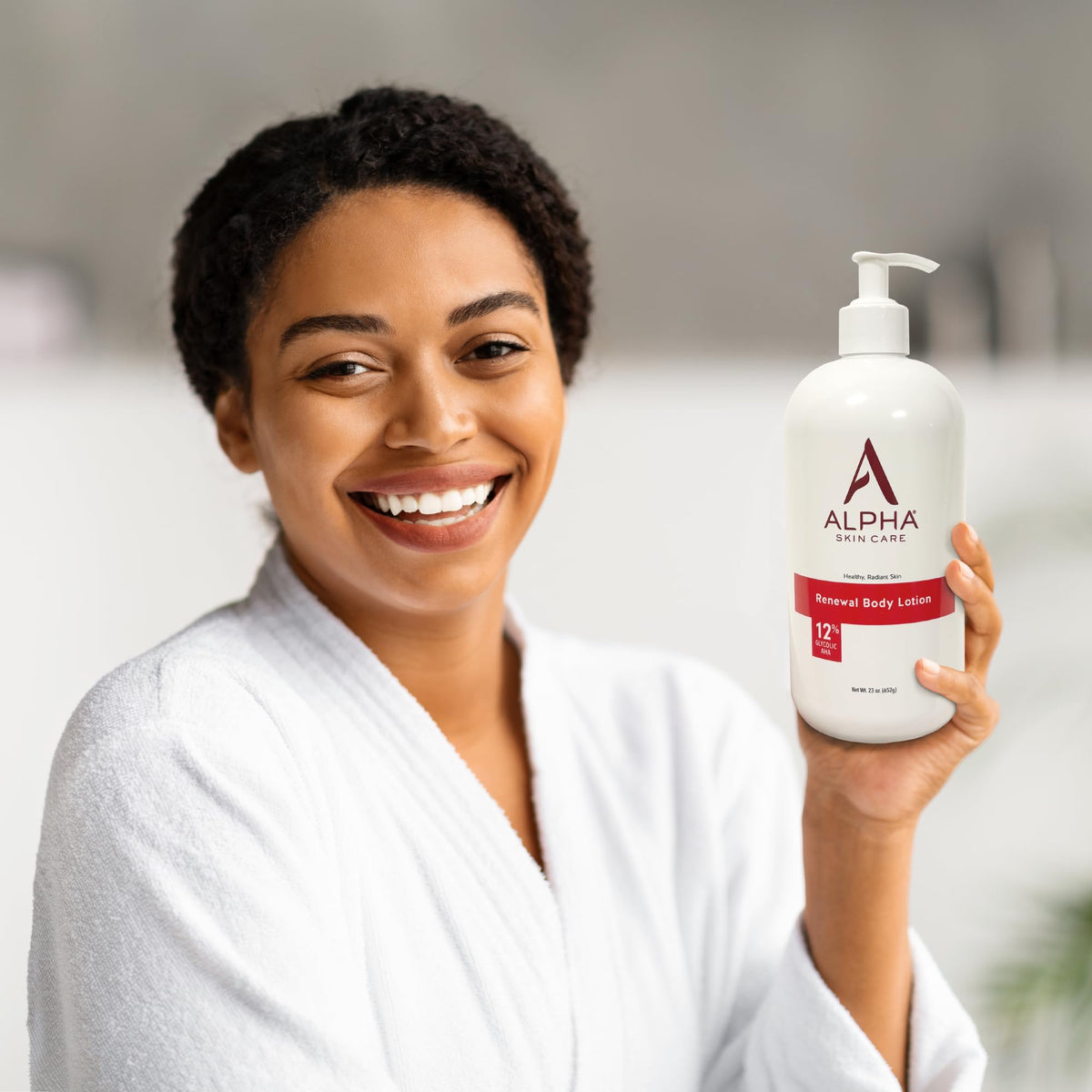 Alpha applying lotion to leg demonstrating exfoliation and long-lasting hydration