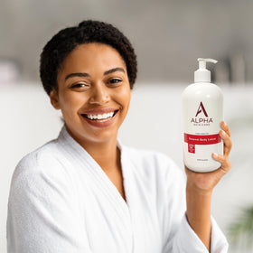 Alpha applying lotion to leg demonstrating exfoliation and long-lasting hydration