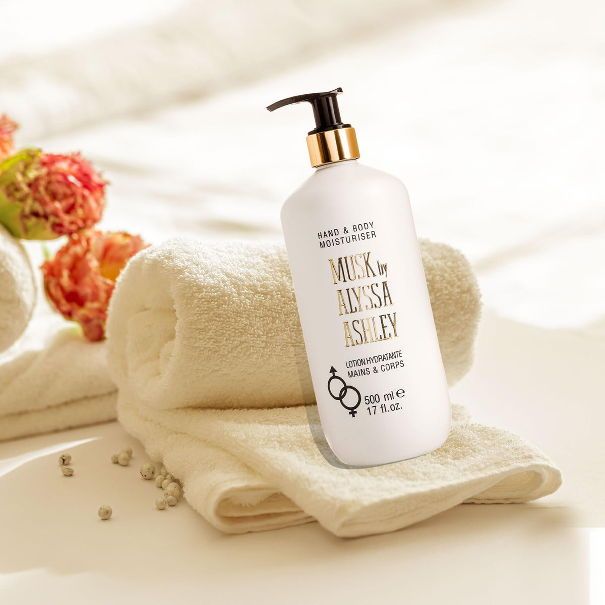 Alyssa Ashley close-up of lotion being dispensed from pump highlighting texture and quick absorption benefit