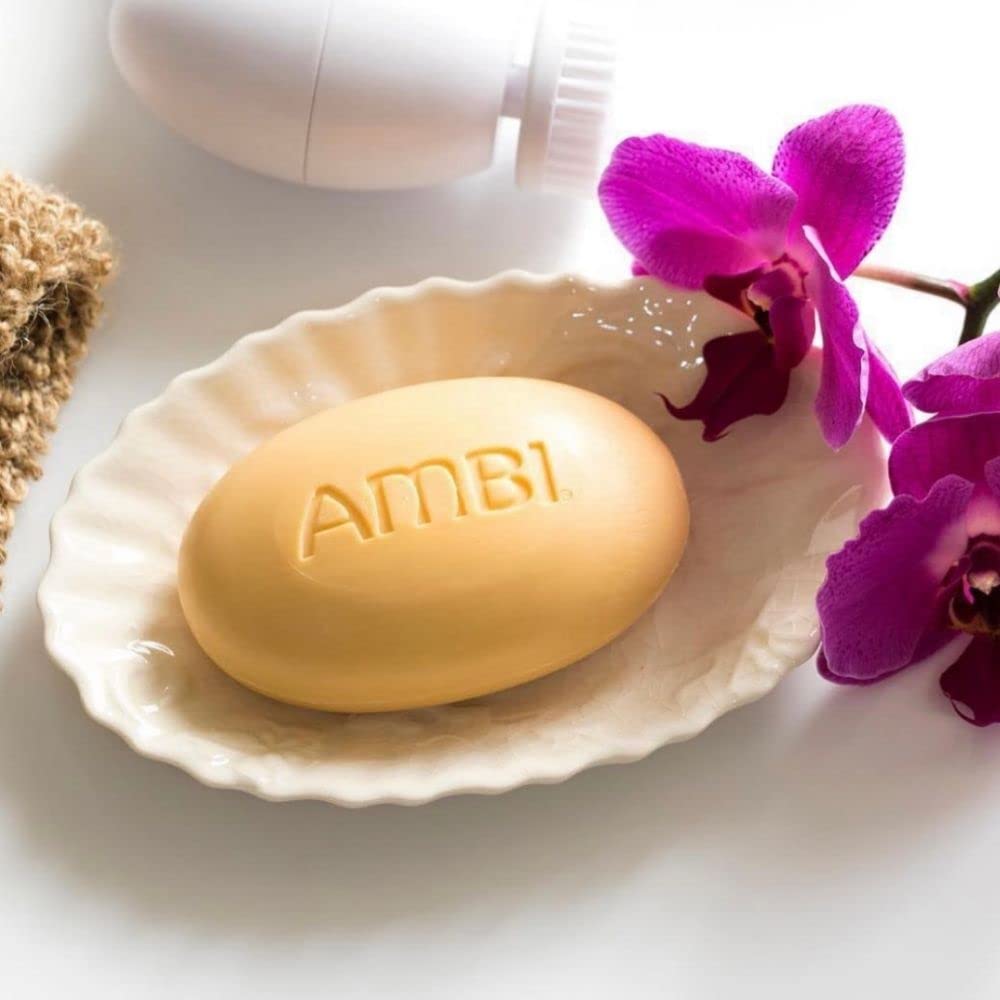 Cut section of Ambi cocoa butter bar revealing internal texture and moisturizing formulation
