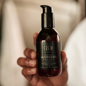 AMERICAN CREW label close-up highlighting SPF 15 and ingredient benefits