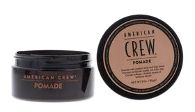 American Crew pomade on hand during application demonstrating controlled styling