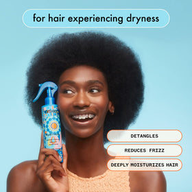 amika in use on towel-dried hair for easier detangling and smoother hair