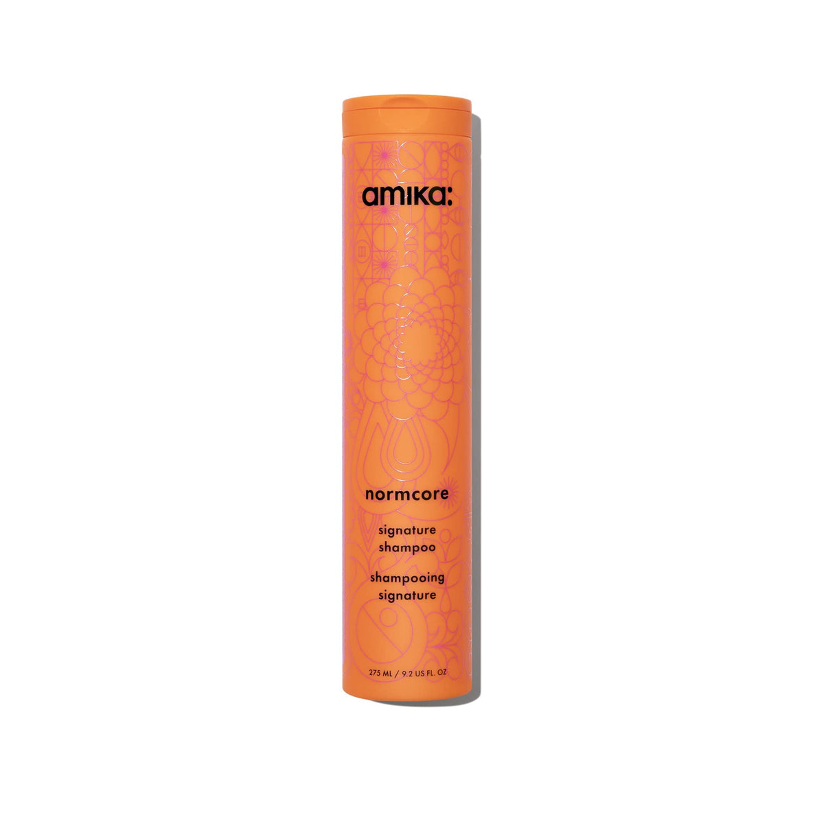 Amika Normcore front bottle view showing clean branding and easy-pour cap benefit