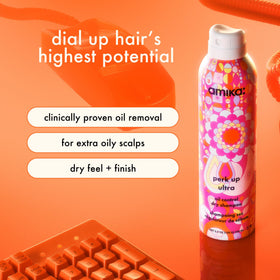 Amika Perk Up Ultra aerosol nozzle close-up illustrating precise application control