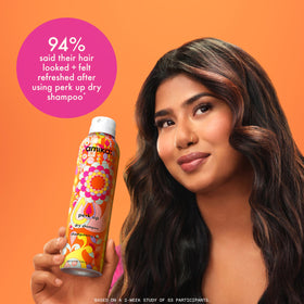 amika applied to dark hair demonstrating invisible finish without white residue
