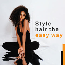 AmPro being applied to hair by stylist for defined, touchable hold benefit
