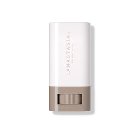 Anastasia Beverly Hills balm being applied to cheek, demonstrates natural coverage and radiance benefit
