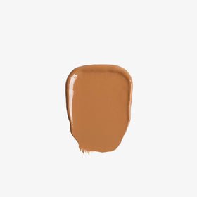 Anastasia Beverly Hills applying balm to cheek for natural coverage and glow benefit