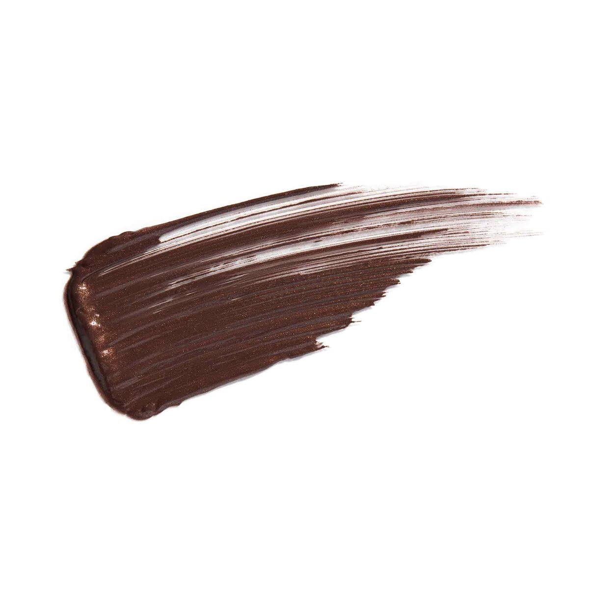 Anastasia Beverly Hills model applying Espresso gel showing groomed brows and warm glow