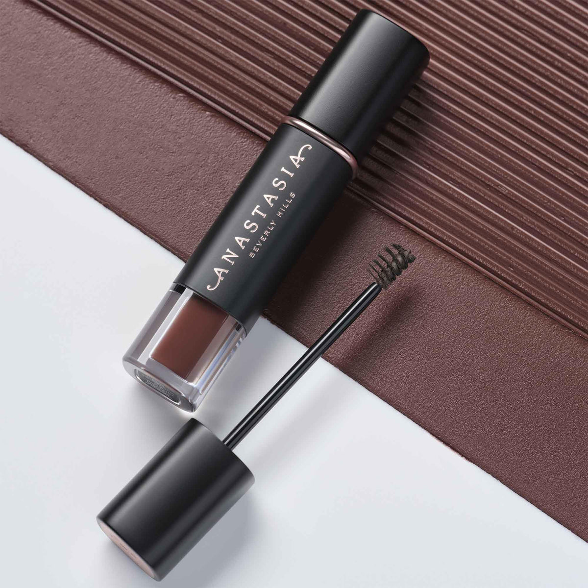 Anastasia Beverly Hills size comparison beside makeup tools for travel convenience