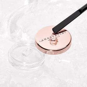 Anastasia Beverly Hills tool distributing wax across brow hairs for consistent hold