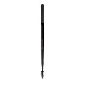 Anastasia Beverly Hills spatula close-up pressing hairs for laminated finish
