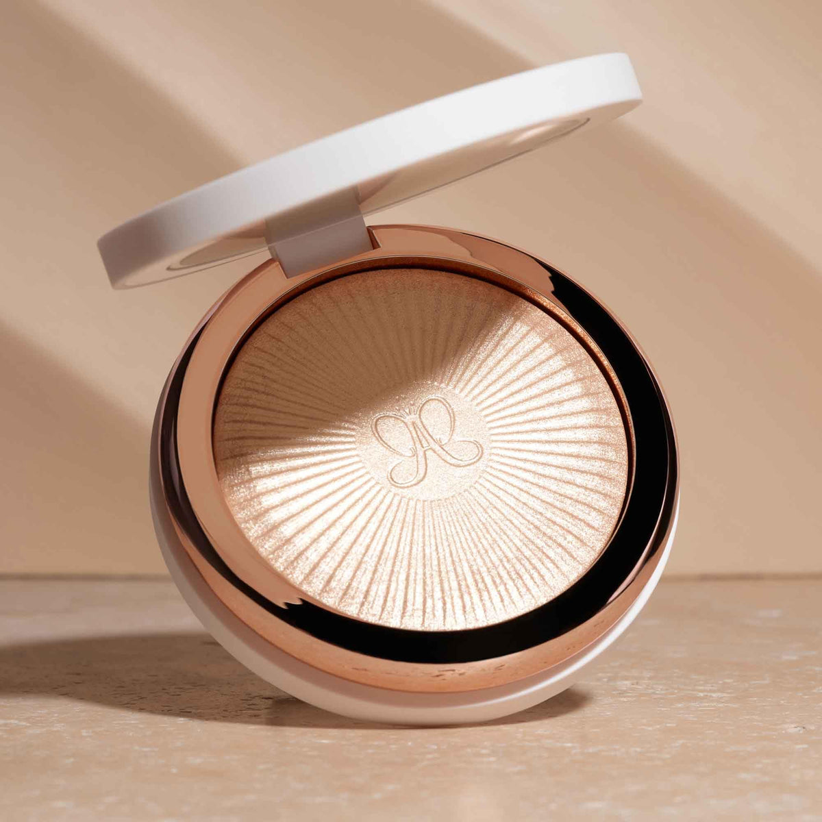 Anastasia Beverly Hills application on cheek showing radiant sun-kissed effect