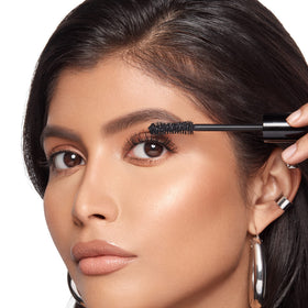 Anastasia Beverly Hills mascara on model close-up showing lifted, full lashes for polished look