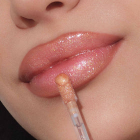 Anastasia Beverly Hills Latte gloss on model lips for luminous finish