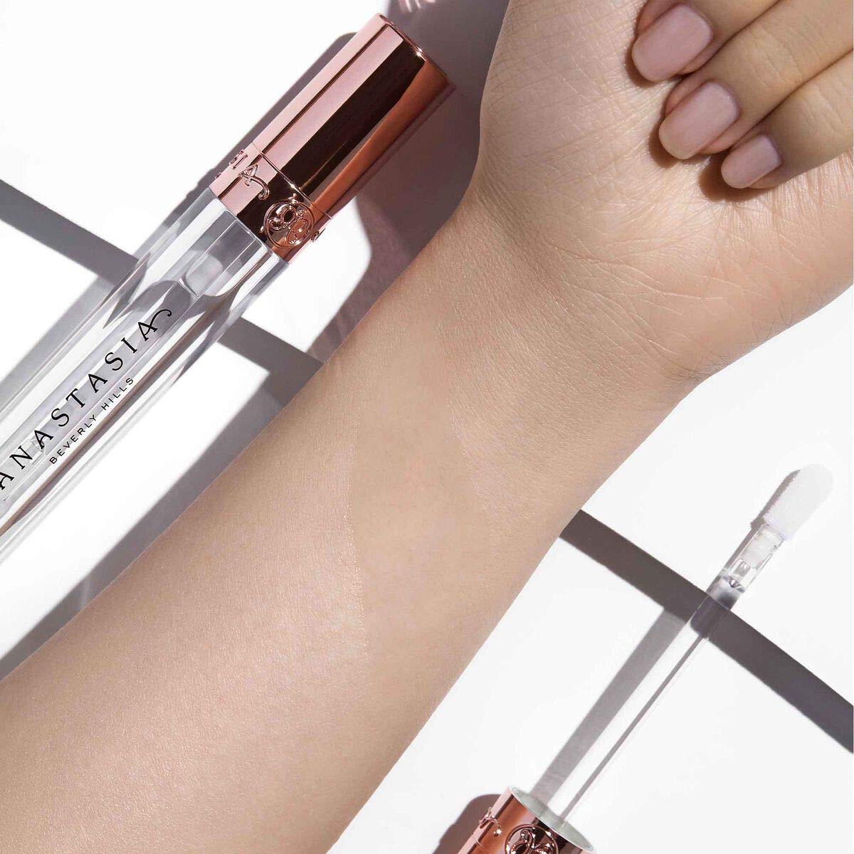 Anastasia Beverly Hills gloss on model lips illustrating fuller-looking, luminous result