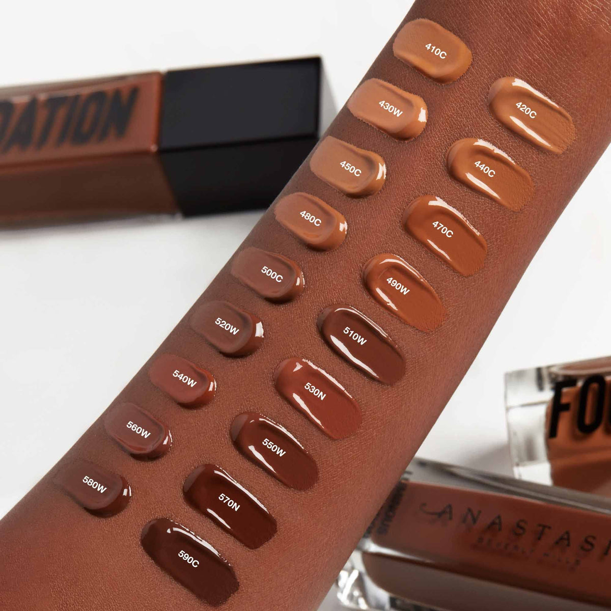 Anastasia Beverly Hills 140N shade swatched on jawline for accurate color match benefit