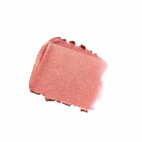 Anastasia Beverly Hills stick blush in use blending with built-in synthetic brush for seamless natural color
