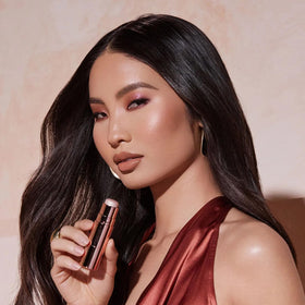 Anastasia Beverly Hills highlighter in use on cheek demonstrating luminous effect