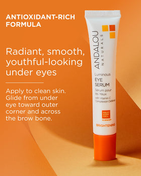 Andalou Naturals product being applied under eye to reduce puffiness appearance