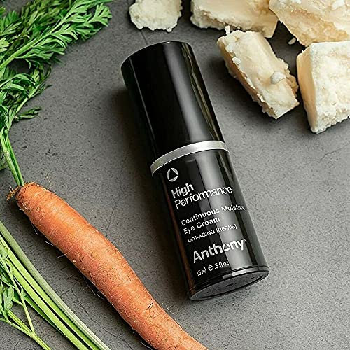 Anthony application with fingertip applying cream under eye to reduce puffiness