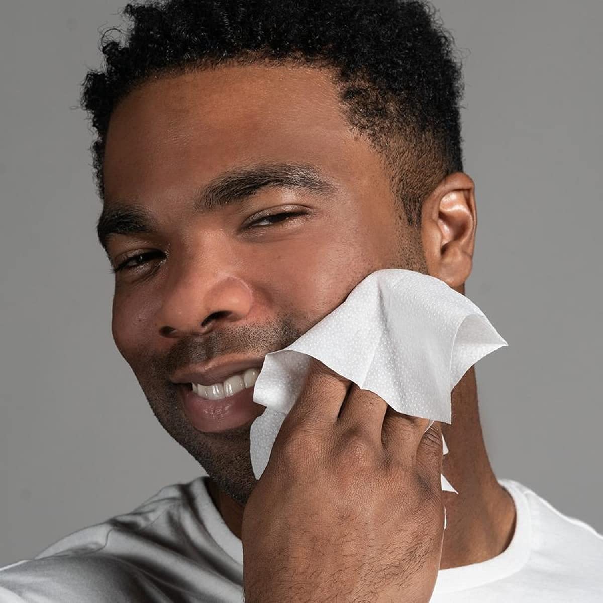 Anthony wipe in hand wiping face after workout for quick clean refresh