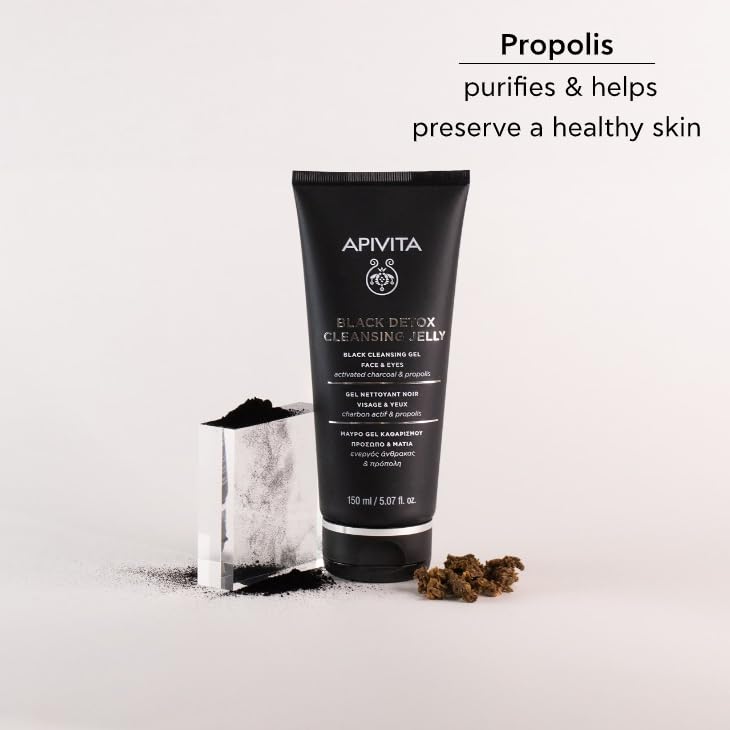 Apivita in bathroom routine beside towel, conveying refreshed skin benefit
