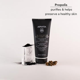 Apivita in bathroom routine beside towel, conveying refreshed skin benefit