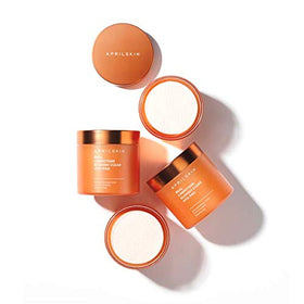 APRILSKIN pad held in hand to show size and one-application scale