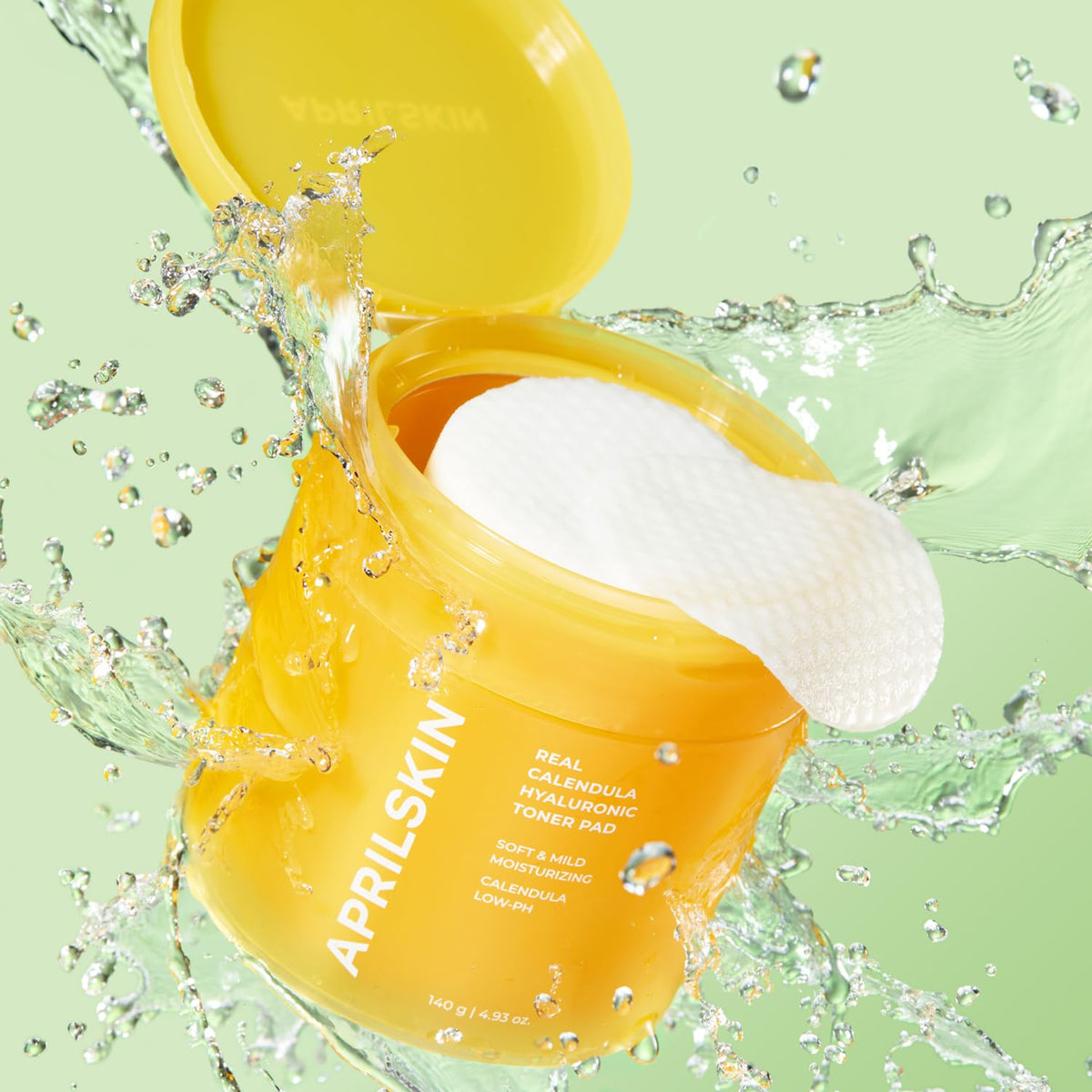 APRILSKIN pad held in hand to show scale and simple single-step skincare convenience