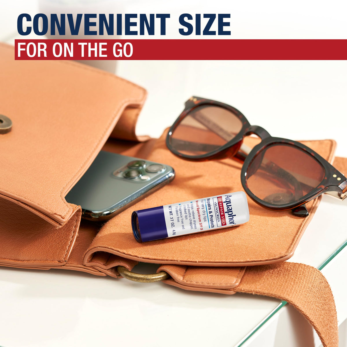 Aquaphor sticks next to keys demonstrating compact pocket-friendly benefit