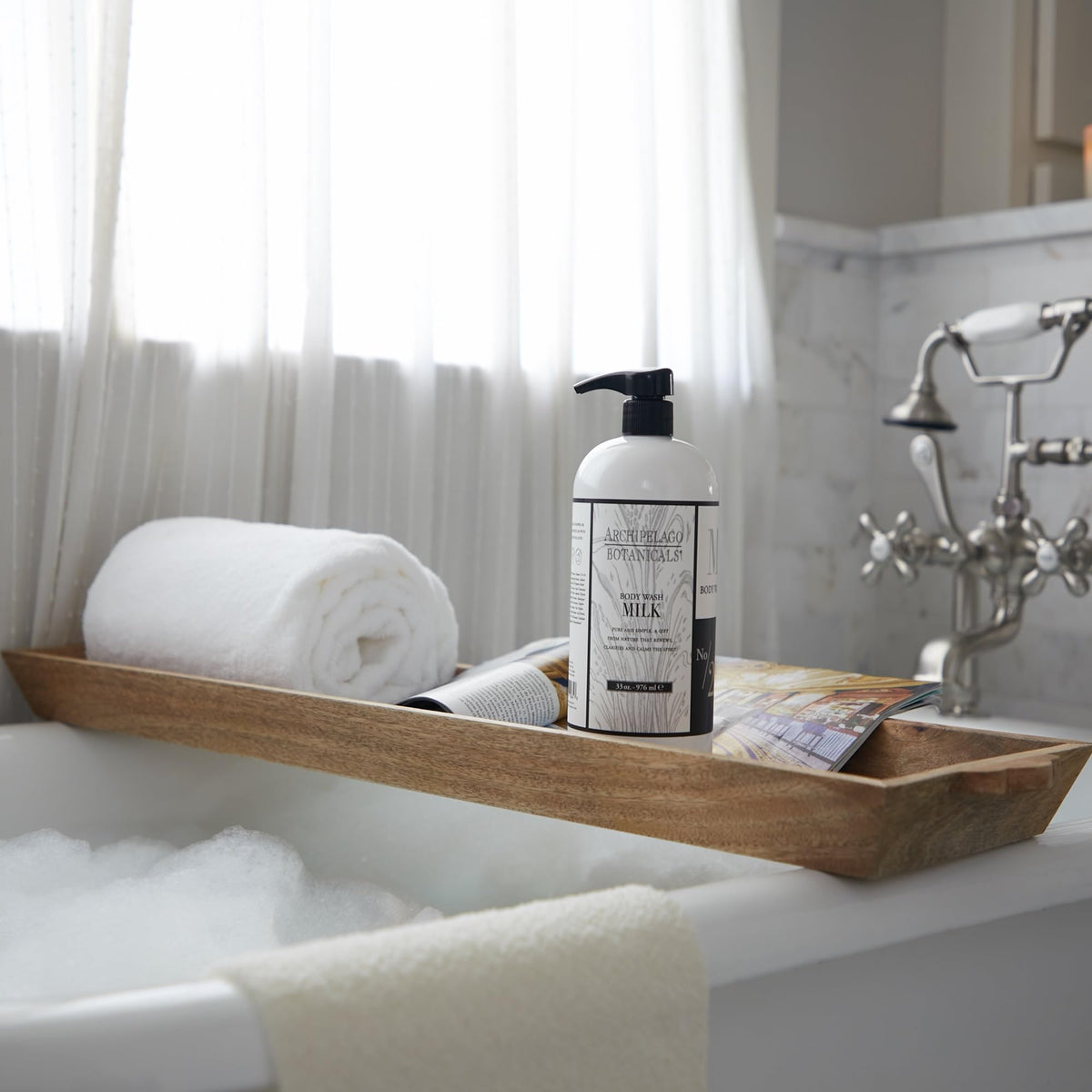 Archipelago Botanicals creamy lather on shower pouf for gentle cleansing