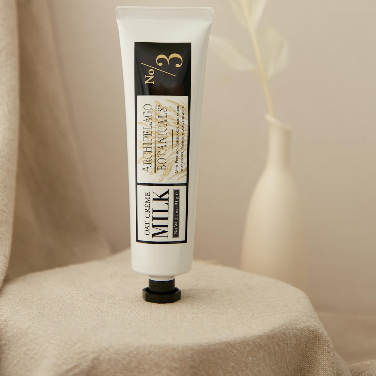 Archipelago Botanicals applying cream to hands demonstrating quick absorption benefit