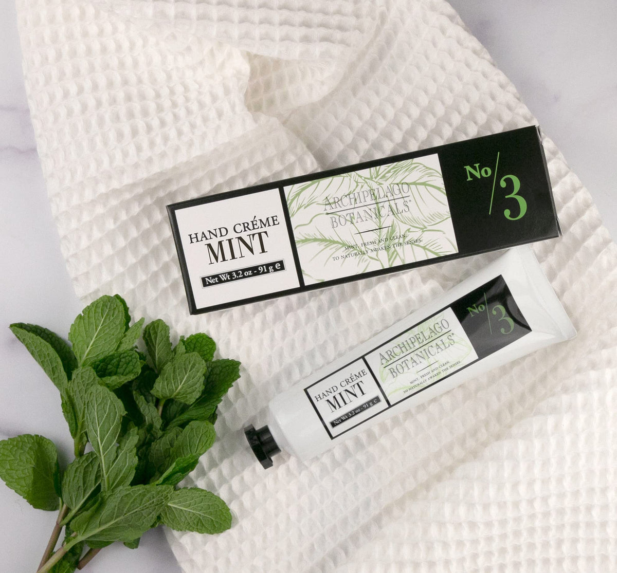Archipelago Botanicals hand application demonstrating quick absorption and non-greasy feel