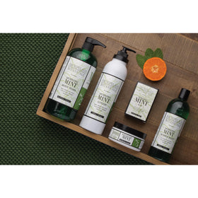 Archipelago Botanicals bottle next to a water glass showing 33 oz size and value benefit