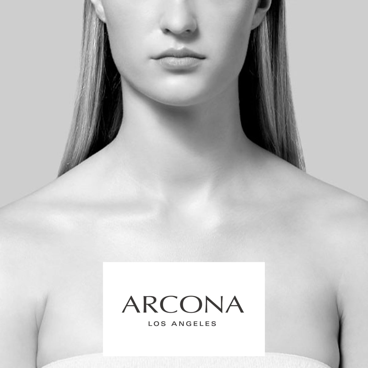 ARCONA flat lay with pad, serum, and moisturizer showing layered routine