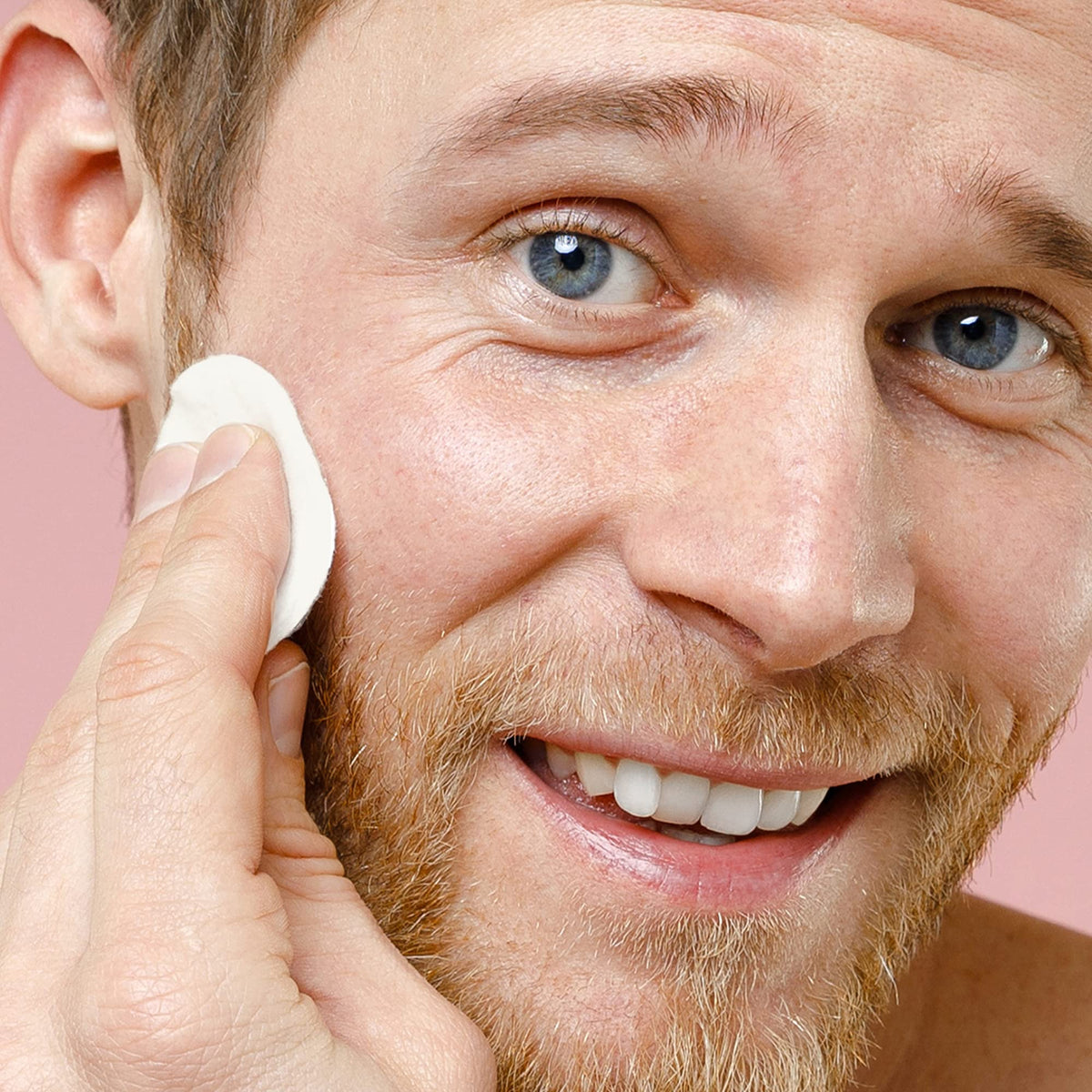 ARCONA pad applied to beard area reducing ingrown hair and soothing irritation