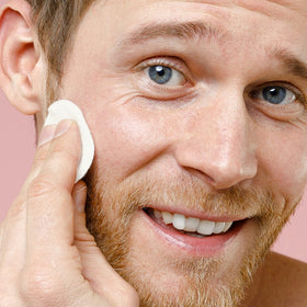 ARCONA pad applied to beard area reducing ingrown hair and soothing irritation