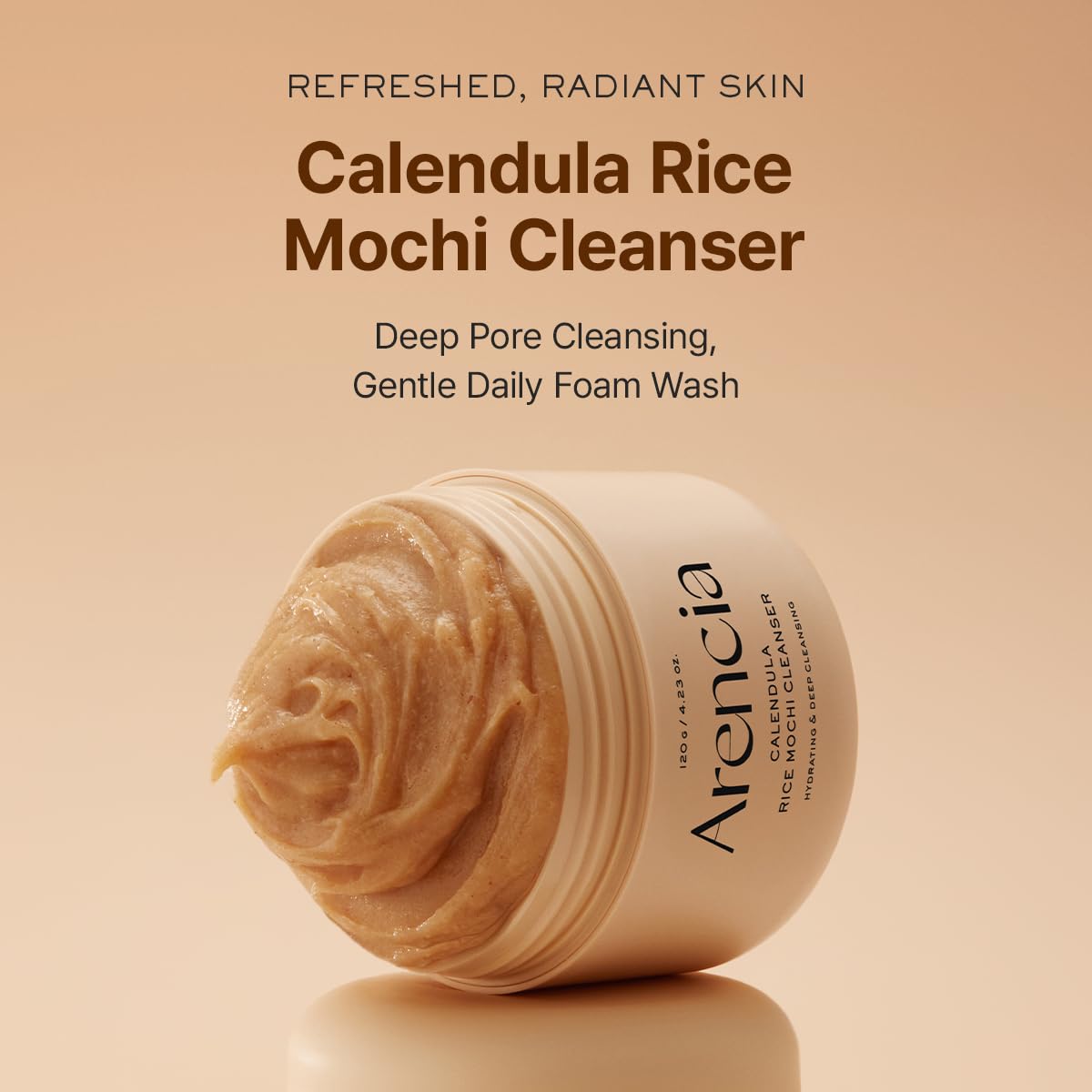 ARENCIA creamy cleanser texture close-up showing gentle exfoliation