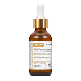Argan Cosmetics bottle pouring oil to show cold-pressed purity and easy dispensing benefit