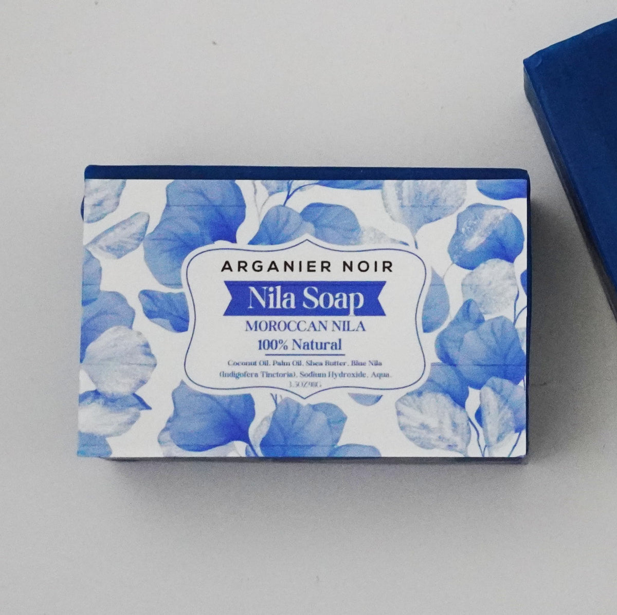 Arganier Noir soap on bathroom shelf conveying artisanal, natural ritual