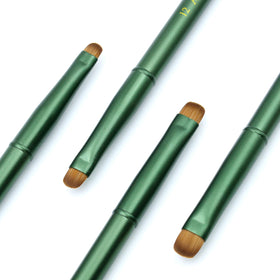 Aridito brushes creating a French tip on a nail to demonstrate accuracy and smooth application