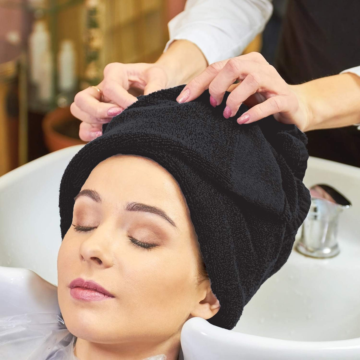 Arkwright towel wrapped on client by hairstylist for quick-dry convenience