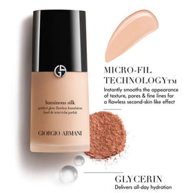 Armani Beauty Luminous Silk in mirror lifestyle scene showing polished radiant complexion benefit