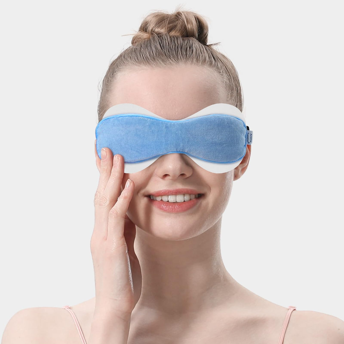 Aroma Season eyelid sheet positioned inside heated eye mask, protects mask and skin benefit