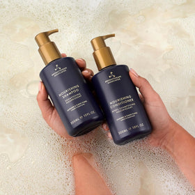 Aromatherapy Associates bottle on bathroom counter evoking calming self-care and hydration