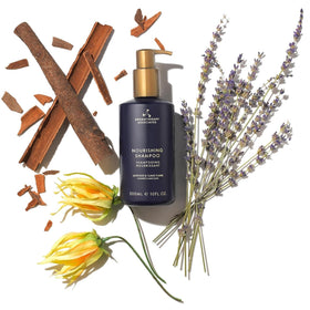 Aromatherapy Associates bottle on shower shelf suggesting daily use and organized routine