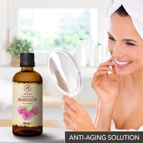 AROMATIKA oil pouring into hand displaying easy application and nourishment