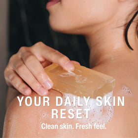 Aromavita soap applied to feet in shower to refresh and cleanse
